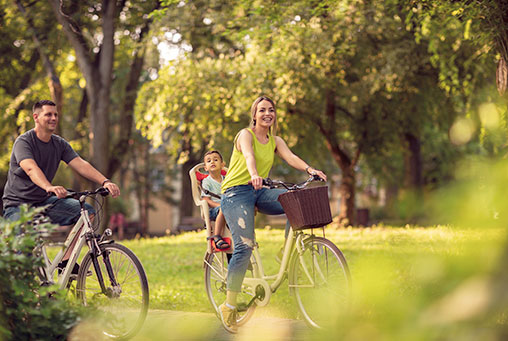 Family on bikes in Millet