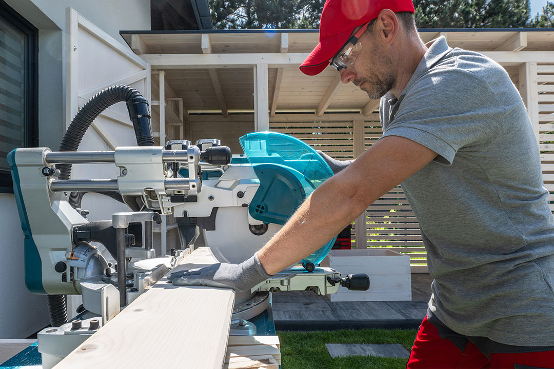 Subcontractor working with a saw