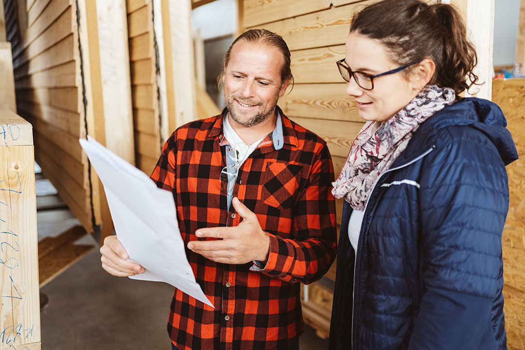 Two people consulting at a renovation site